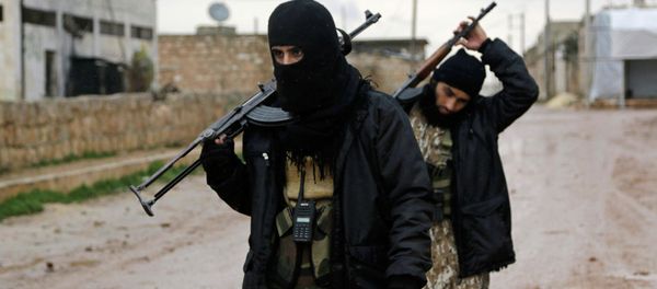 Rebel fighters carry their weapons as they walk in Ratian village, north of Aleppo, following what they said was an offensive against them by forces loyal to Syria's President Bashar al-Assad in an attempt to advance in the village but failed - Sputnik International
