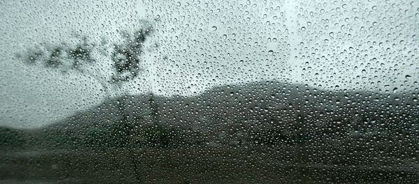 A landscape is seen through a wet window from inside a car in Lima A landscape is seen through a wet window from inside a car in Lima - Sputnik International