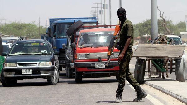 A member of Somali security forces patrols the streets in the capital Mogadishu A member of Somali security forces patrols the streets in the capital Mogadishu - Sputnik International