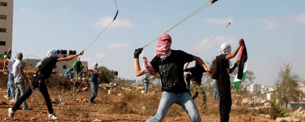 Palestinians throw stones during clashes with Israeli soldiers on the 13th anniversary of the second Palestinian Intifada. Palestinians throw stones during clashes with Israeli soldiers on the 13th anniversary of the second Palestinian Intifada. - Sputnik International
