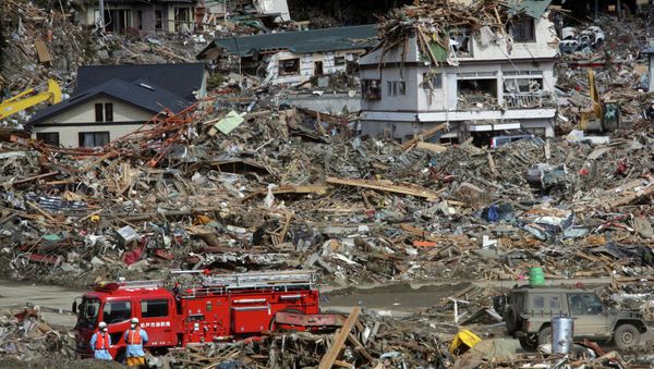 Fire fighters search for survivors following the March 11 earthquake and tsunami in Rikuzentakata, Iwate prefecture, northeastern Japan, Friday, March 18, 2011. (File) Fire fighters search for survivors following the March 11 earthquake and tsunami in Rikuzentakata, Iwate prefecture, northeastern Japan, Friday, March 18, 2011. (File) - Sputnik International