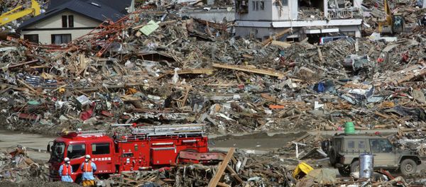 Fire fighters search for survivors following the March 11 earthquake and tsunami in Rikuzentakata, Iwate prefecture, northeastern Japan, Friday, March 18, 2011. (File) Fire fighters search for survivors following the March 11 earthquake and tsunami in Rikuzentakata, Iwate prefecture, northeastern Japan, Friday, March 18, 2011. (File) - Sputnik International