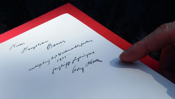 One of two rare copies of Mein Kampf signed by the young Nazi leader Adolf Hitler and due for auction, photographed in Los Angeles, California - Sputnik International