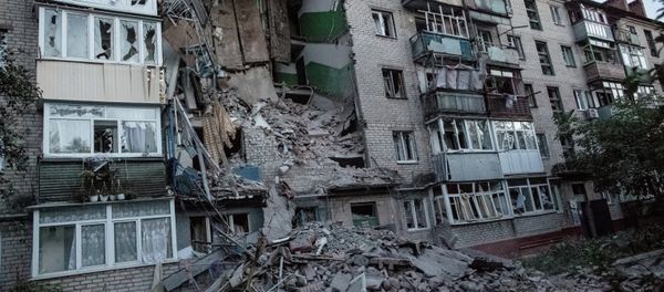 The aftermath of an artillery shelling of Slavyansk by the Ukrainian military. Debris and a burning house The aftermath of an artillery shelling of Slavyansk by the Ukrainian military. Debris and a burning house - Sputnik International