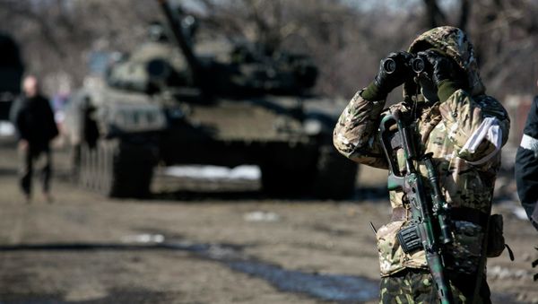 A fighter with the independence supporters of self-proclaimed Donetsk People's Republic Army uses a pair of binoculars at a checkpoint on the road from the town of Vuhlehirsk to Debaltseve February 18, 2015 A fighter with the independence supporters of self-proclaimed Donetsk People's Republic Army uses a pair of binoculars at a checkpoint on the road from the town of Vuhlehirsk to Debaltseve February 18, 2015 - Sputnik International