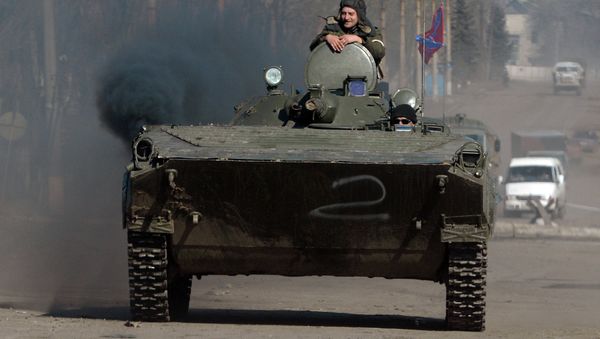 Independence supporters drive armoured personnel carrier (APC) in the eastern Ukrainian city of Debaltseve in the Donetsk region, on February 22, 2015 Independence supporters drive armoured personnel carrier (APC) in the eastern Ukrainian city of Debaltseve in the Donetsk region, on February 22, 2015 - Sputnik International
