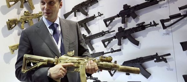 Aleksey Krivoruchko, chief executive of Russian firearms maker Kalashnikov Concern, holds a weapon during the International Defence Exhibition (IDEX) in Abu Dhabi February 22, 2015 Aleksey Krivoruchko, chief executive of Russian firearms maker Kalashnikov Concern, holds a weapon during the International Defence Exhibition (IDEX) in Abu Dhabi February 22, 2015 - Sputnik International