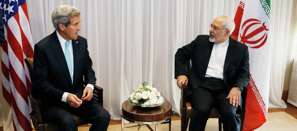 U.S. Secretary of State John Kerry, left, waits with Iranian Foreign Minister Mohammad Javad Zarif before a meeting in Geneva. U.S. Secretary of State John Kerry, left, waits with Iranian Foreign Minister Mohammad Javad Zarif before a meeting in Geneva. - Sputnik International