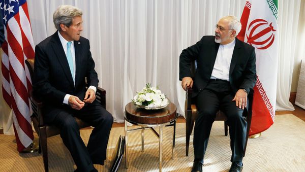 U.S. Secretary of State John Kerry, left, waits with Iranian Foreign Minister Mohammad Javad Zarif before a meeting in Geneva. U.S. Secretary of State John Kerry, left, waits with Iranian Foreign Minister Mohammad Javad Zarif before a meeting in Geneva. - Sputnik International