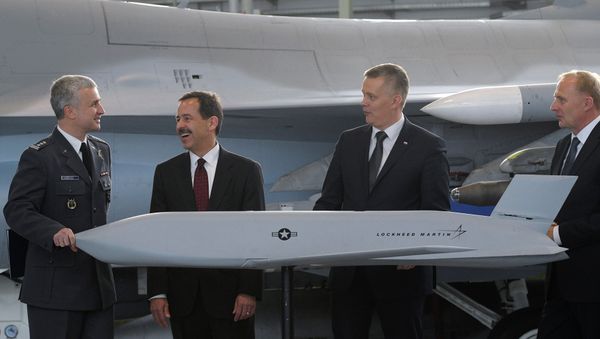 Polish and US officials with a model of the JASSM air-to-surface missile system, purchased by Poland in December, 2014. Polish and US officials with a model of the JASSM air-to-surface missile system, purchased by Poland in December, 2014. - Sputnik International