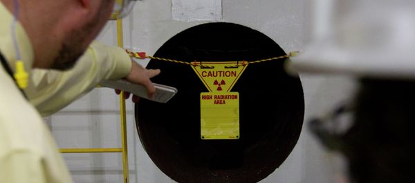 US federal state regulators warned about a radioactive uranium leak that occurred at a nuclear fuel plant in South Carolina. Above: Reporters point to a hole in the wall with a radioactive warning on it near the containment vessel of the Unit 1 reactor during a tour of the Browns Ferry nuclear plant in Athens, Ala., Friday, March 25, 2011 US federal state regulators warned about a radioactive uranium leak that occurred at a nuclear fuel plant in South Carolina. Above: Reporters point to a hole in the wall with a radioactive warning on it near the containment vessel of the Unit 1 reactor during a tour of the Browns Ferry nuclear plant in Athens, Ala., Friday, March 25, 2011 - Sputnik International