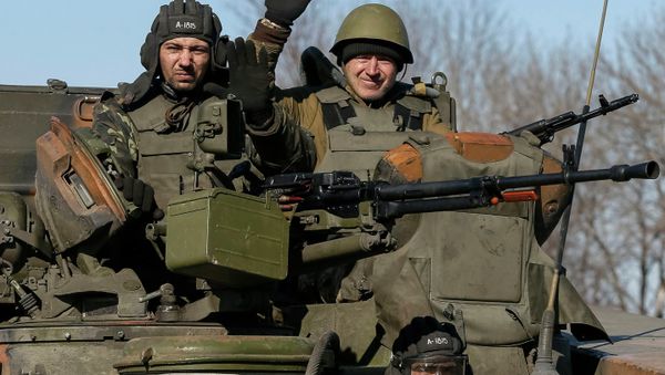 Members of the Ukrainian armed forces ride an armoured personnel carrier near Artemivsk, eastern Ukraine, February 22, 2015 Members of the Ukrainian armed forces ride an armoured personnel carrier near Artemivsk, eastern Ukraine, February 22, 2015 - Sputnik International