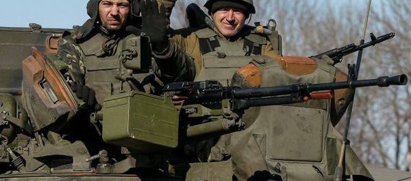 Members of the Ukrainian armed forces ride an armoured personnel carrier near Artemivsk, eastern Ukraine, February 22, 2015 Members of the Ukrainian armed forces ride an armoured personnel carrier near Artemivsk, eastern Ukraine, February 22, 2015 - Sputnik International