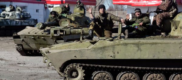 Fighters with the self-proclaimed Donetsk People's Republic army sit on top of mobile artillery units in the town of Debaltseve February 22, 2015 Fighters with the self-proclaimed Donetsk People's Republic army sit on top of mobile artillery units in the town of Debaltseve February 22, 2015 - Sputnik International