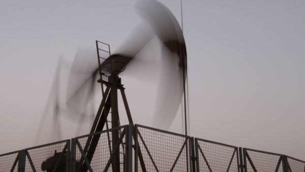 An oil pump jack works at sunset in the desert oil fields of Sakhir, Bahrain, Monday, June 10, 2013 An oil pump jack works at sunset in the desert oil fields of Sakhir, Bahrain, Monday, June 10, 2013 - Sputnik International