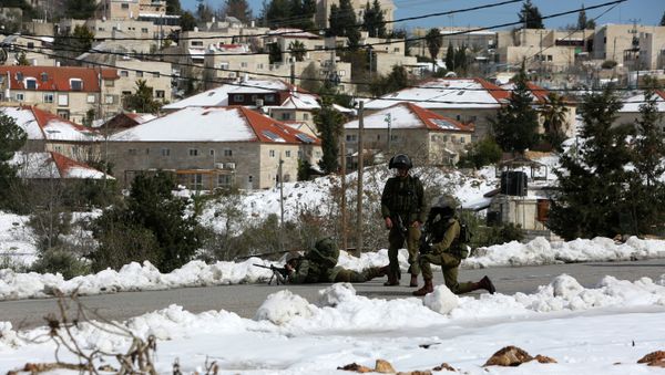 Israeli security forces stand guard during clashes with Palestinian youths from the Jalazoun refugee camp. File photo Israeli security forces stand guard during clashes with Palestinian youths from the Jalazoun refugee camp. File photo - Sputnik International
