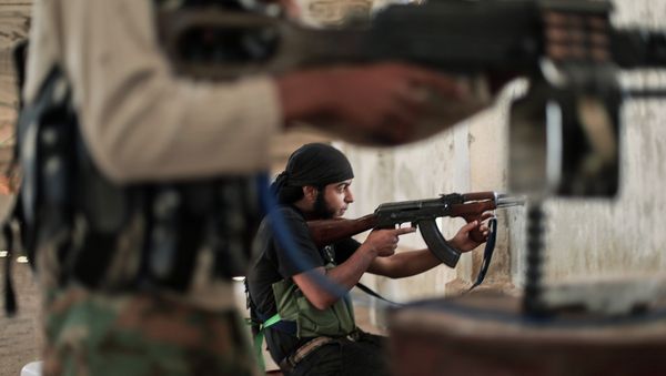 Rebel fighters from the Islamic Front, Syria's largest rebel coalition, hold a position on July 13, 2014 during clashes with militants of the Islamic State (IS), formerly known as the Islamic State in Iraq and the Levant (ISIL) Rebel fighters from the Islamic Front, Syria's largest rebel coalition, hold a position on July 13, 2014 during clashes with militants of the Islamic State (IS), formerly known as the Islamic State in Iraq and the Levant (ISIL) - Sputnik International