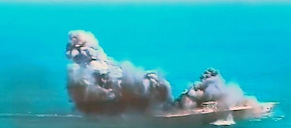 This image taken from Iranian state TV, shows damage to a mock U.S. aircraft carrier during large-scale naval and air defense drills by Iran's Revolutionary Guard, near the Strait of Hormuz, Iran This image taken from Iranian state TV, shows damage to a mock U.S. aircraft carrier during large-scale naval and air defense drills by Iran's Revolutionary Guard, near the Strait of Hormuz, Iran - Sputnik International