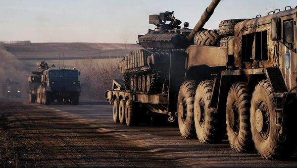 Military trucks from the Ukrainian armed forces transport tanks on the road near Artemivsk, eastern Ukraine, February 24, 2015 Military trucks from the Ukrainian armed forces transport tanks on the road near Artemivsk, eastern Ukraine, February 24, 2015 - Sputnik International