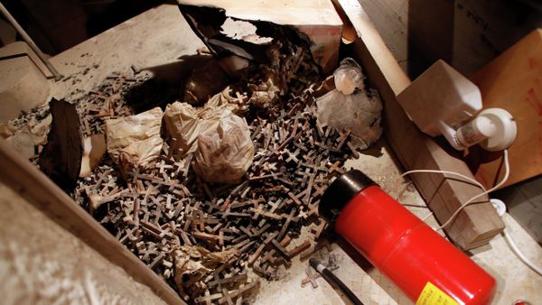 A picture taken on May 26, 2014 shows burnt wooden crosses and a fire extinguisher after arsonists set fire to a small section of the Church of the Dormition - Sputnik International