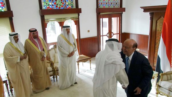 Yemen's President Abd-Rabbu Mansour Hadi (R) shakes hands with a Gulf Cooperation Council (GCC) delegate as the GCC Secretary-General Abdulatif al-Zayani (3rd L) looks ahead of talks at the Republian Palace in the southern Yemeni port city of Aden February 25, 2015 Yemen's President Abd-Rabbu Mansour Hadi (R) shakes hands with a Gulf Cooperation Council (GCC) delegate as the GCC Secretary-General Abdulatif al-Zayani (3rd L) looks ahead of talks at the Republian Palace in the southern Yemeni port city of Aden February 25, 2015 - Sputnik International