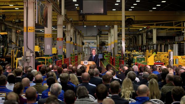 British Prime Minister David Cameron, background centre, delivers a speech on immigration to factory workers and members of the media, at JCB World Headquarters in Rocester, central England British Prime Minister David Cameron, background centre, delivers a speech on immigration to factory workers and members of the media, at JCB World Headquarters in Rocester, central England - Sputnik International
