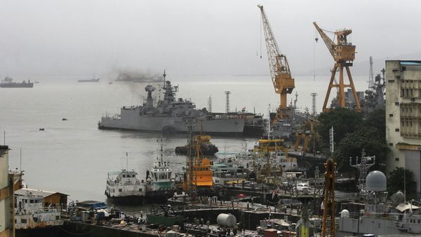 Ships ride at anchors at a naval dockyard where a submarine caught fire and sank after an explosion early Wednesday in Mumbai, India. Flie photo - Sputnik International