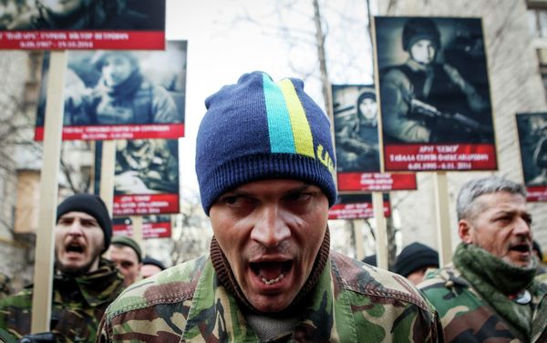 Activists of the Right Sector political party attend an anti-government march in Kiev February 25, 2015 Activists of the Right Sector political party attend an anti-government march in Kiev February 25, 2015 - Sputnik International