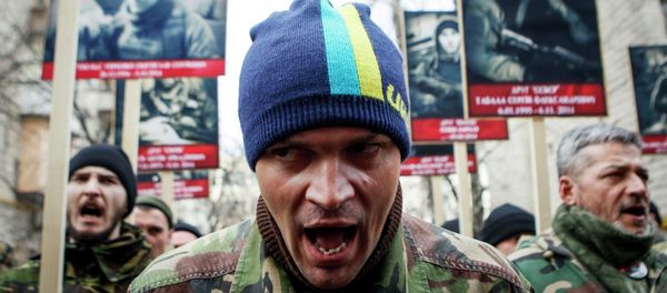 Activists of the Right Sector political party attend an anti-government march in Kiev February 25, 2015 - Sputnik International