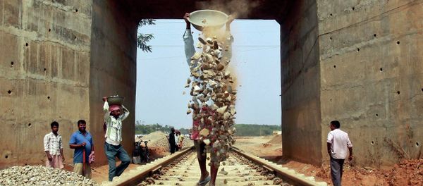 Labourers work at the installation site of a new railway track on the outskirts of Agartala, capital of India's northeastern state of Tripura February 25, 2015 Labourers work at the installation site of a new railway track on the outskirts of Agartala, capital of India's northeastern state of Tripura February 25, 2015 - Sputnik International