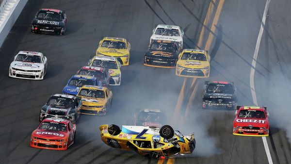 Regan Smith, driver of the #7 Hellmann's Chevrolet, flips over during an on-track incident during the NASCAR XFINITY Series Alert Today Florida 300 at Daytona International Speedway on February 21, 2015 in Daytona Beach, Florida - Sputnik International