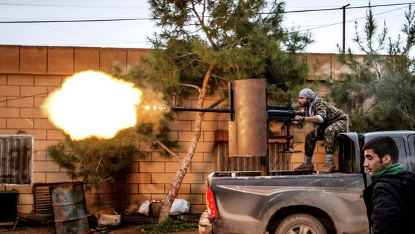A fighter of the Kurdish People's Protection Units (YPG) fires an anti-aircraft weapon from Tel Tawil village in the direction of Islamic State fighters positioned in the countryside of the town of Tel Tamr February 25, 2015 - Sputnik International