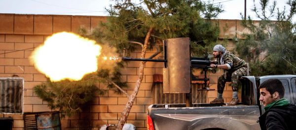 A fighter of the Kurdish People's Protection Units (YPG) fires an anti-aircraft weapon from Tel Tawil village in the direction of Islamic State fighters positioned in the countryside of the town of Tel Tamr February 25, 2015 A fighter of the Kurdish People's Protection Units (YPG) fires an anti-aircraft weapon from Tel Tawil village in the direction of Islamic State fighters positioned in the countryside of the town of Tel Tamr February 25, 2015 - Sputnik International