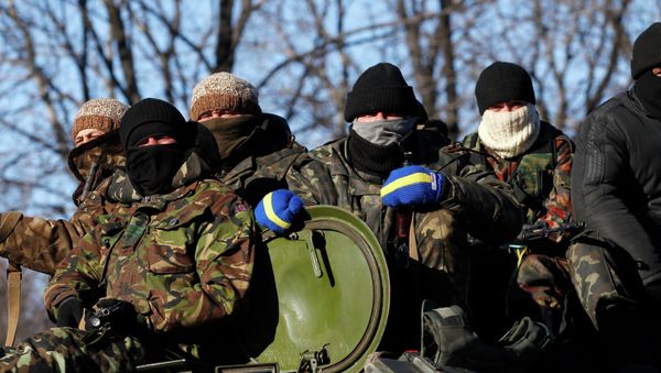 Ukrainian government soldiers sit on top of their vehicle driving on a road stretching away from the town of Artemivsk, Ukraine Ukrainian government soldiers sit on top of their vehicle driving on a road stretching away from the town of Artemivsk, Ukraine - Sputnik International