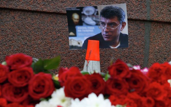A photo and flowers are placed at the site where Boris Nemtsov was shot dead, near the Kremlin in central Moscow, February 28, 2015. A photo and flowers are placed at the site where Boris Nemtsov was shot dead, near the Kremlin in central Moscow, February 28, 2015. - Sputnik International
