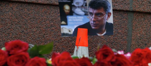 A photo and flowers are placed at the site where Boris Nemtsov was shot dead, near the Kremlin in central Moscow, February 28, 2015. A photo and flowers are placed at the site where Boris Nemtsov was shot dead, near the Kremlin in central Moscow, February 28, 2015. - Sputnik International