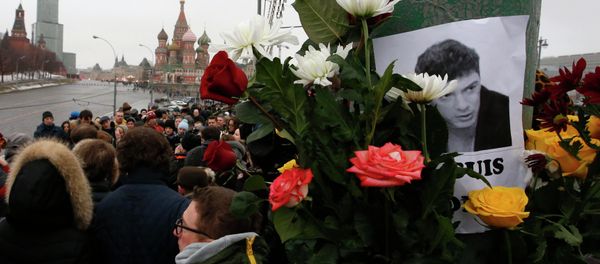People gather at the site where Boris Nemtsov was recently murdered, with St. Basil's Cathedral and the Kremlin seen in the background, in central Moscow, February 28, 2015. People gather at the site where Boris Nemtsov was recently murdered, with St. Basil's Cathedral and the Kremlin seen in the background, in central Moscow, February 28, 2015. - Sputnik International