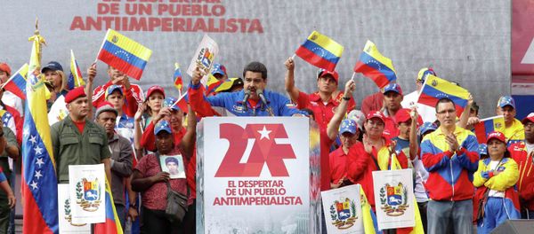Venezuela's President Nicolas Maduro (C) speaks during a rally to commemorate the 26th anniversary of the social uprising known as 'Caracazo', which Venezuela's late President Hugo Chavez said marked the start of his revolution, in Caracas in this February 28, 2015 picture provided by Miraflores Palace. Venezuela's President Nicolas Maduro (C) speaks during a rally to commemorate the 26th anniversary of the social uprising known as 'Caracazo', which Venezuela's late President Hugo Chavez said marked the start of his revolution, in Caracas in this February 28, 2015 picture provided by Miraflores Palace. - Sputnik International