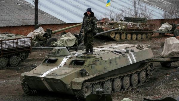 Armoured personnel carriers, military vehicles and cannons are seen at their new position as they pull back from the Horlivka region, near Druzhkivka, eastern Ukraine - Sputnik International