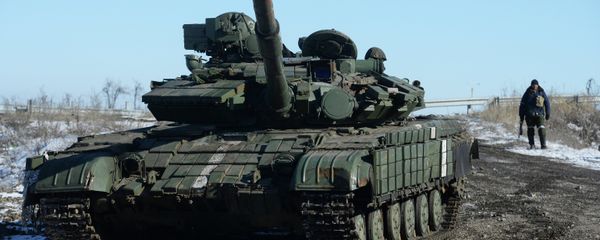 A self-defender of the Lugansk People's Republic near a captured T-64 tank in Debaltsevo. A self-defender of the Lugansk People's Republic near a captured T-64 tank in Debaltsevo. - Sputnik International