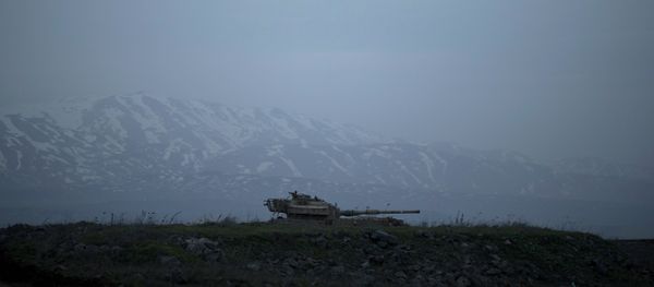 An old Israeli tank sits in a position in the Israeli-controlled Golan Heights near the border with Syria An old Israeli tank sits in a position in the Israeli-controlled Golan Heights near the border with Syria - Sputnik International