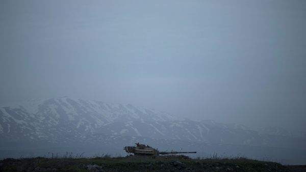 An old Israeli tank sits in a position in the Israeli-controlled Golan Heights near the border with Syria An old Israeli tank sits in a position in the Israeli-controlled Golan Heights near the border with Syria - Sputnik International