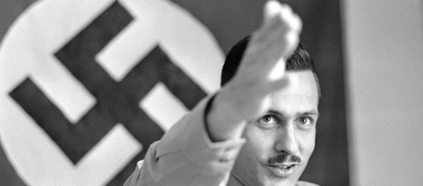 Matt Koehl, commander of the National Socialist White People’s Party, talks of the future of his movement at party headquarters in Arlington, Virginia on August 26, 1971. Matt Koehl, commander of the National Socialist White People’s Party, talks of the future of his movement at party headquarters in Arlington, Virginia on August 26, 1971. - Sputnik International