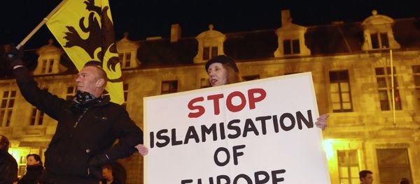 Members of the Belgian branch of Germany's anti-Islam group, PEGIDA (Patriotic Europeans Against the Islamisation of the West), take part in a demonstration in Antwerp Members of the Belgian branch of Germany's anti-Islam group, PEGIDA (Patriotic Europeans Against the Islamisation of the West), take part in a demonstration in Antwerp - Sputnik International