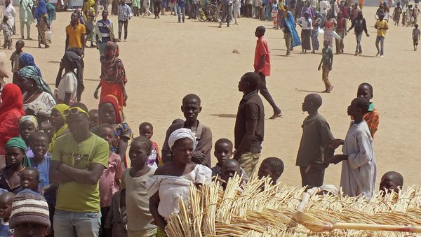 In this photo taken on Wednesday, Feb. 25, 2015, refugees that fled their homes due to violence from the Islamic extremists group Boko Haram inside a refugee camp in Minawao, Cameroon In this photo taken on Wednesday, Feb. 25, 2015, refugees that fled their homes due to violence from the Islamic extremists group Boko Haram inside a refugee camp in Minawao, Cameroon - Sputnik International