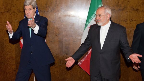 U.S. Secretary of State John Kerry (L) and his Iranian counterpart Mohammad Javad Zarif discuss seating arrangements for a meeting during a new round of nuclear negotiations in Montreux March 2, 2015 U.S. Secretary of State John Kerry (L) and his Iranian counterpart Mohammad Javad Zarif discuss seating arrangements for a meeting during a new round of nuclear negotiations in Montreux March 2, 2015 - Sputnik International