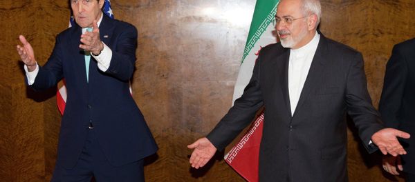 U.S. Secretary of State John Kerry (L) and his Iranian counterpart Mohammad Javad Zarif discuss seating arrangements for a meeting during a new round of nuclear negotiations in Montreux March 2, 2015 U.S. Secretary of State John Kerry (L) and his Iranian counterpart Mohammad Javad Zarif discuss seating arrangements for a meeting during a new round of nuclear negotiations in Montreux March 2, 2015 - Sputnik International