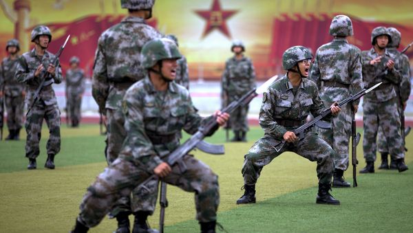 Chinese People's Liberation Army cadets shout as they take part in a bayonet drills at the PLA's Armoured Forces Engineering Academy Base, on the outskirt of Beijing, China Chinese People's Liberation Army cadets shout as they take part in a bayonet drills at the PLA's Armoured Forces Engineering Academy Base, on the outskirt of Beijing, China - Sputnik International