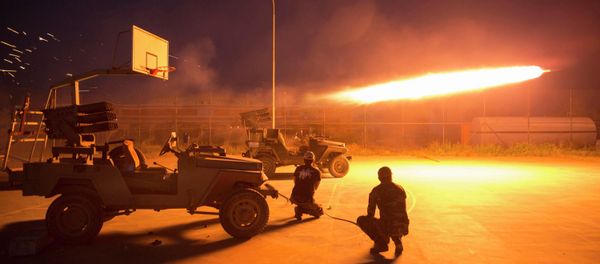 Shi'ite fighters fire a rocket during clashes with Islamic State militants in Salahuddin province March 1, 2015 - Sputnik International