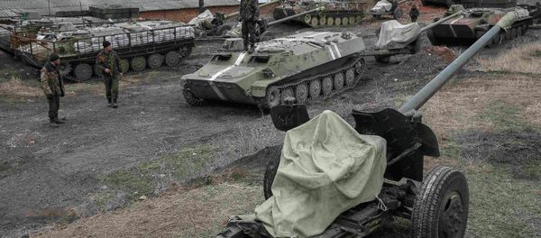 Ukrainian servicemen stand near armoured personnel carriers, military vehicles and cannons at their new position as they pull back from the Horlivka region, near Druzhkivka, eastern Ukraine. Ukrainian servicemen stand near armoured personnel carriers, military vehicles and cannons at their new position as they pull back from the Horlivka region, near Druzhkivka, eastern Ukraine. - Sputnik International